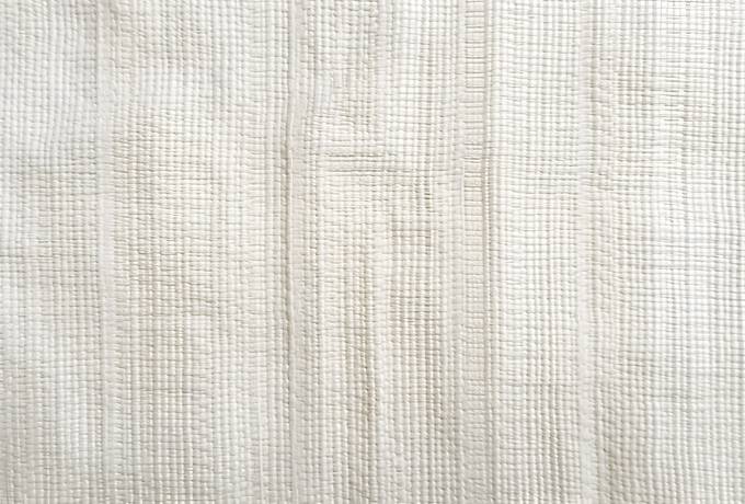 Texture of a Backdrop Composed of Pure White Cotton Fabric